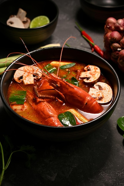 Delicious Tom Yam Kung or Thai spicy coconut milk soup with shrimps