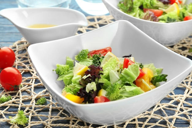 Delicious vegetable salad on table