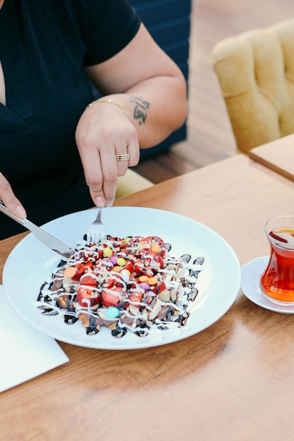 Delicious waffle with chocolate sauce