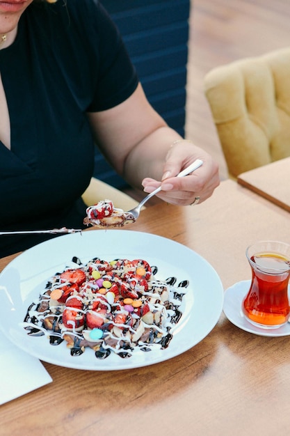 Delicious waffle with chocolate sauce