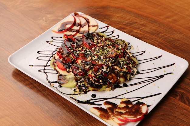 Delicious waffle with chocolate sauce