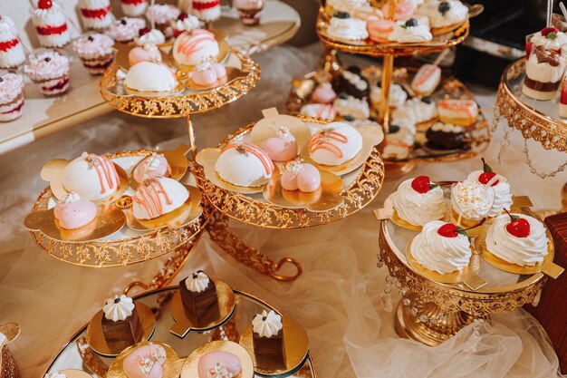 A delicious wedding Candy bar with various chocolates Fruit table Celebration concept Fashionable desserts Table with sweets candies