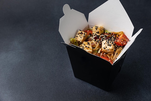 Delicious wok noodles box container. Chinese and asian takeaway fast food.