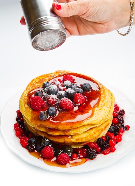 deliciuos pancake with fresh fruit on white