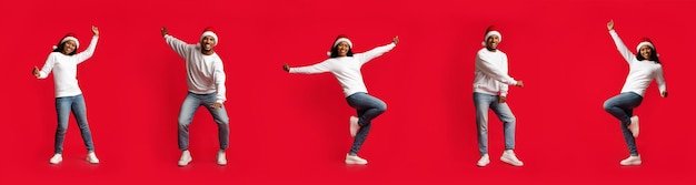 Delighted millennial black couple dancing on red creative image panorama