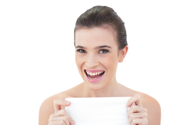 Delighted natural brown haired model holding a tissue