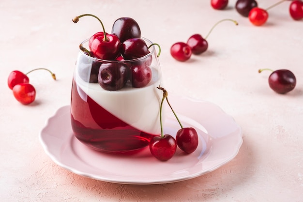 Delisious panna cotta summer dessert with cherries and cherry jelly