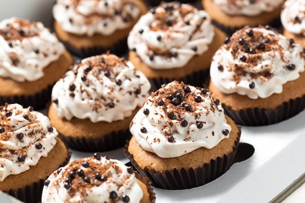 Delivery box with coffee cupcakes decorated mocha buttercream and chocolate chips