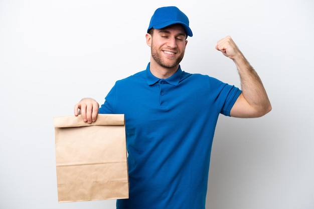 Delivery caucasian man isolated on white background doing strong gesture