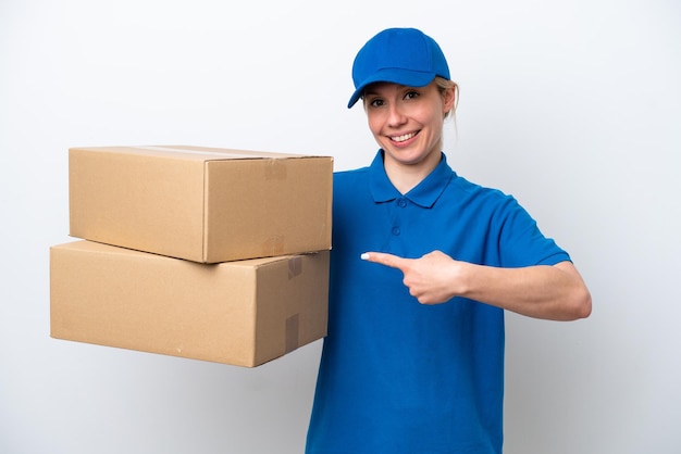 Delivery caucasian woman isolated on white background pointing back