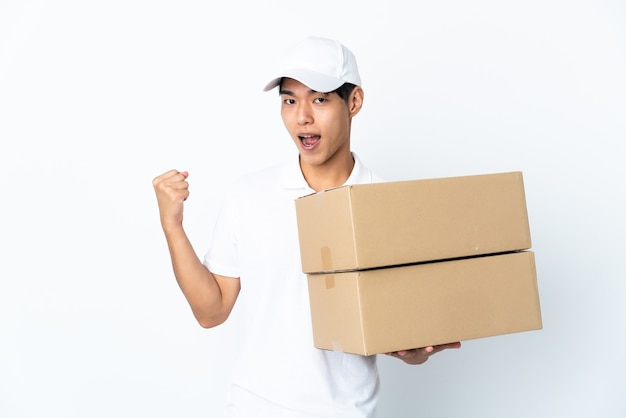 Delivery Chinese man isolated on white background celebrating a victory