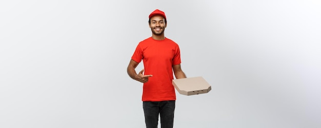 Delivery Concept Portrait of Handsome African American Pizza delivery man Isolated on Grey studio Background Copy Space