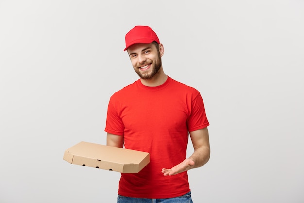 Delivery Concept: Young haapy caucasian Handsome Pizza delivery man holding pizza boxes