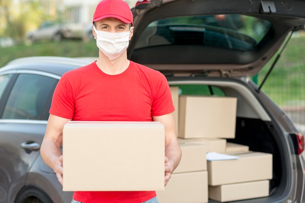 Delivery guy wearing mask front view