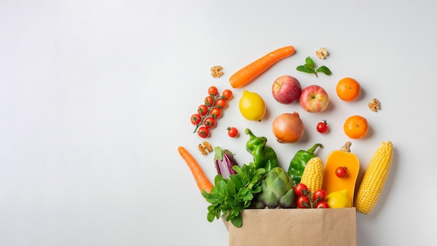 Delivery healthy food background Healthy vegan vegetarian food in paper bag vegetables and fruits on white copy space banner Shopping food supermarket and clean vegan eating concept