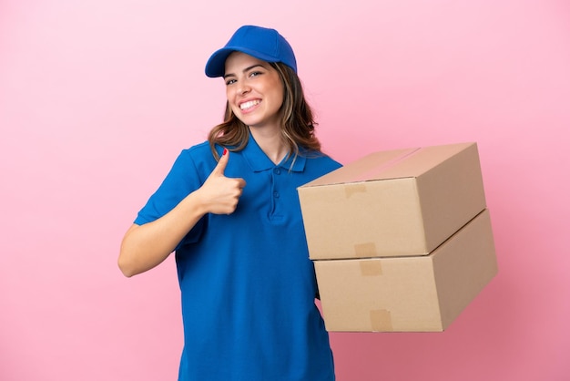 Delivery Italian woman isolated on pink background giving a thumbs up gesture