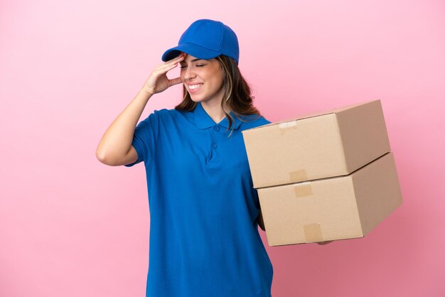 Delivery Italian woman isolated on pink background smiling a lot