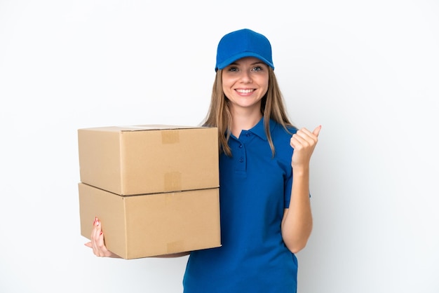 Delivery Lithuanian woman isolated on white background pointing to the side to present a product