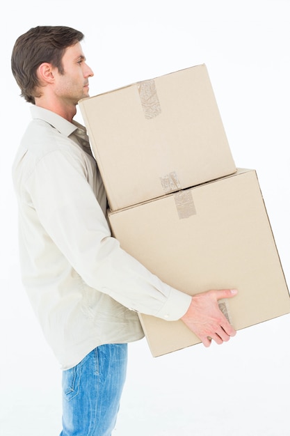 Delivery man carrying cardboard boxes