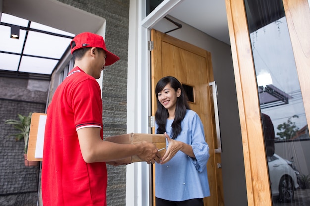 Delivery man delivering box