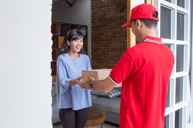 Delivery man delivering box