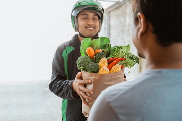 Delivery man delivering grocery