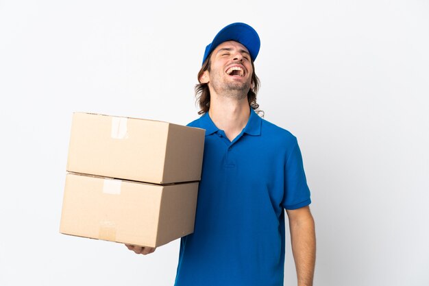 Delivery man isolated on white background laughing