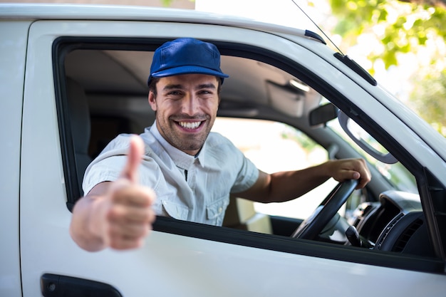 Delivery man sitting in his van