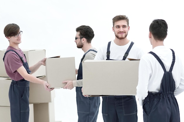 Delivery men with cardboard boxes on white background