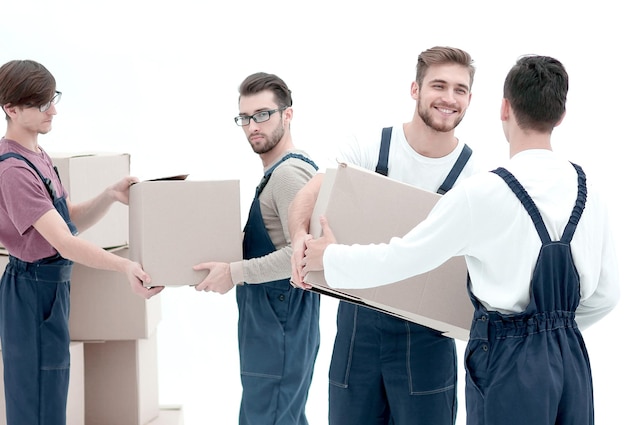 Delivery men with cardboard boxes on white background