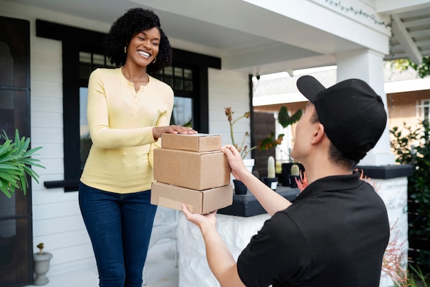 Delivery person getting parcel out for delivery