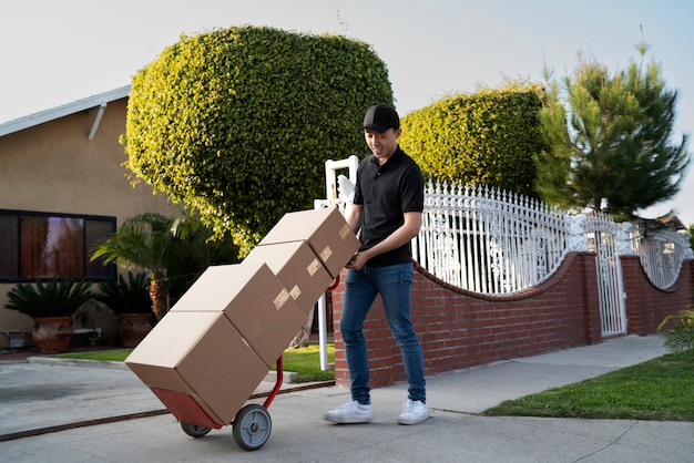 Delivery person getting parcel out for delivery