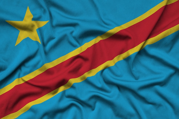 Photo democratic republic of the congo flag  is depicted on a sports cloth fabric with many folds.