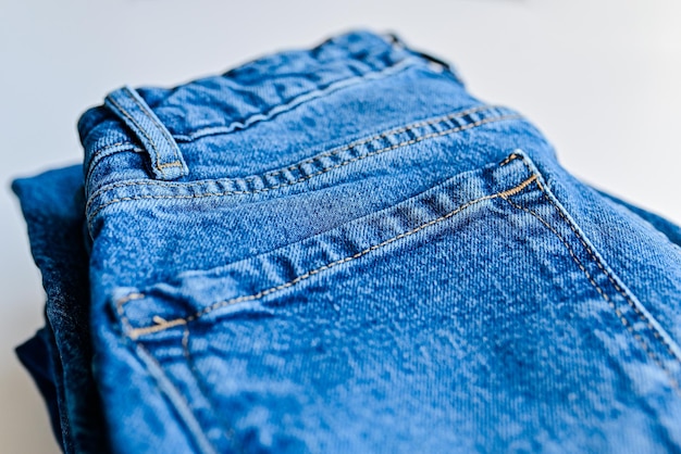 Denim blue jeans on a light background Detail of nice blue jeans