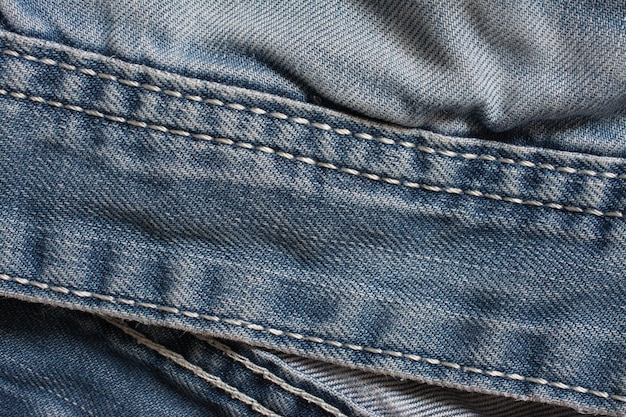 Denim jeans texture cotton fabric Pocket and rivet Textile background