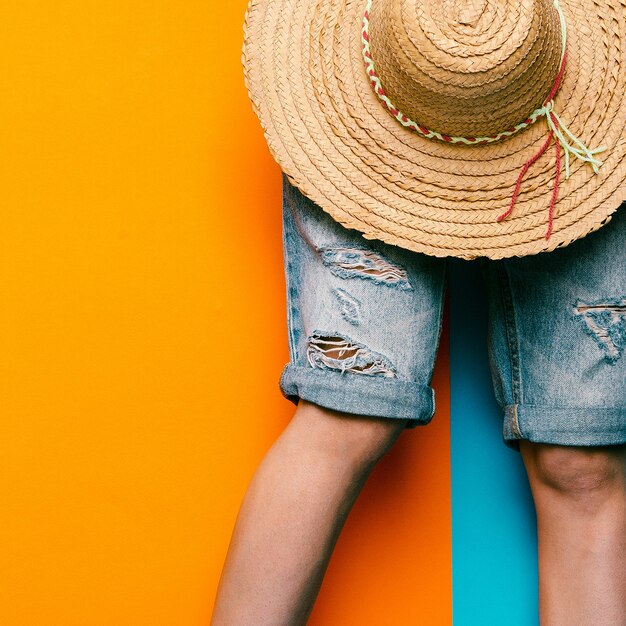 Photo denim shorts and straw hat. minimal style urban fashion