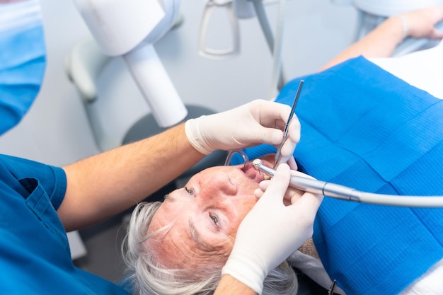 Dental clinic elderly woman at the dentist with the doctor at the denture checkup