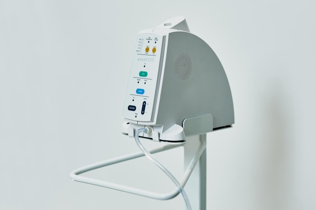 Dental equipment in the office of a dentist doctor with gray walls against the backdrop of bright light from the window