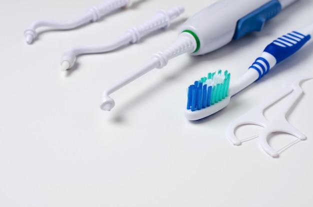 Dental oral irrigator, toothbrush, dental floss. 