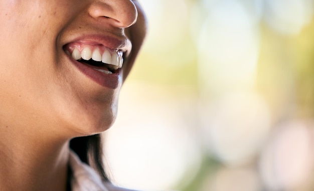 Dental teeth or mouth with a smile in nature laughing after a successful teeth whitening at dentist appointment Mockup space zoom or happy woman smiling at a funny joke while relaxing outdoors