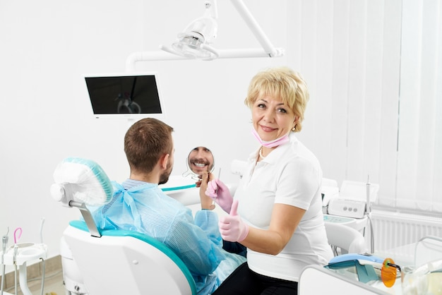 Dentist checking the patient in the clinic