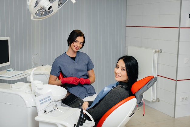 The dentist conducts an examination and consultation of the patient. Dentistry