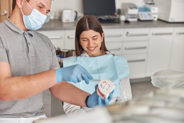 Dentist consultation - patient visit at dental clinics office. Oral checkup at the dentist.