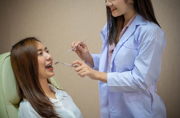 Dentist examining patient's teeth