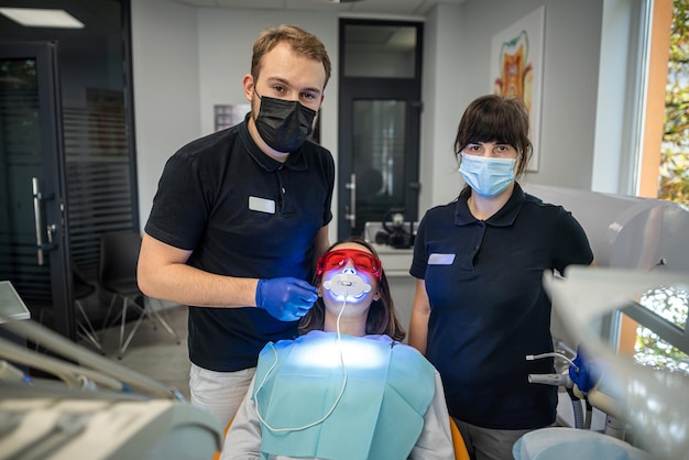 Dentist helps the patient to get a healthy beautiful smile