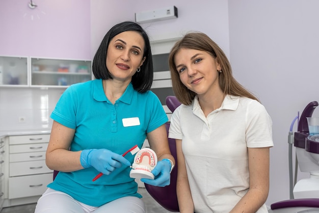 Dentist and patient choose treatment during consultation in beautiful clinic