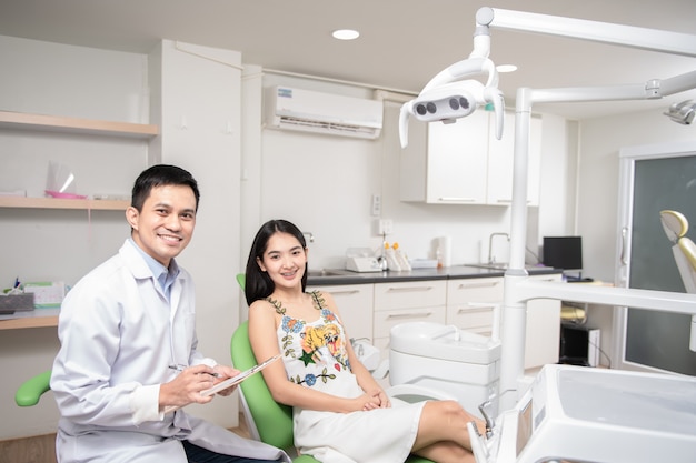 Dentist and patient in dentist office