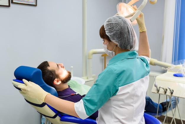 Dentist and patient in dentist office