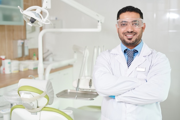 Dentist Posing in Office