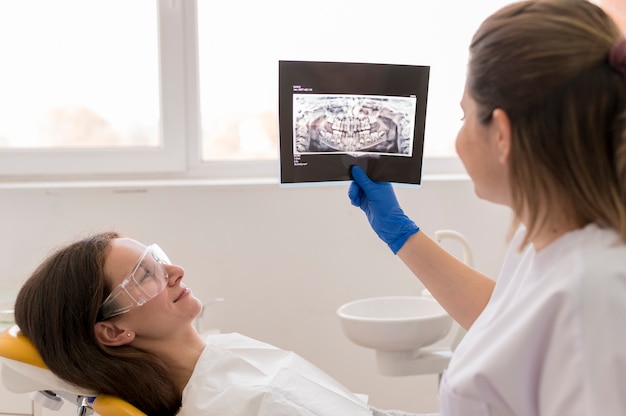 Dentist showing patient their xrays